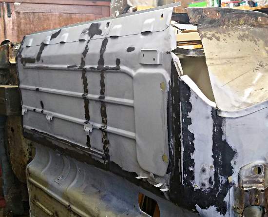 Austin Mini City - re-treating exposed metal before etch-priming.